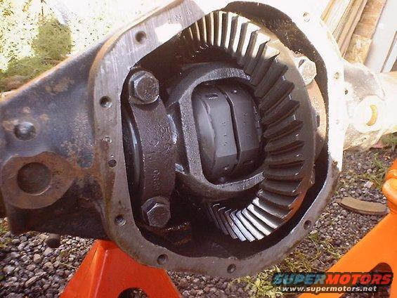 Differential housing with gears and locking mechanism, supported by orange jack stands