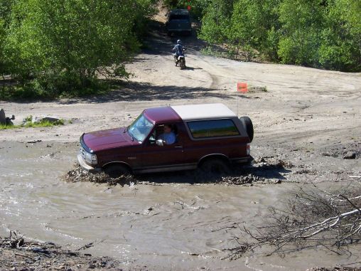 vincemud.jpg Vince playing in the mud with his stocker on 31's