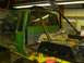 1990 Ford Bronco - This custom truck build features a roll cage and extensive modifications, with the interior stripped down for work.