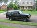 1988 Ford Bronco - This black 1988 Ford Bronco is parked on the street in front of a well-maintained suburban home.