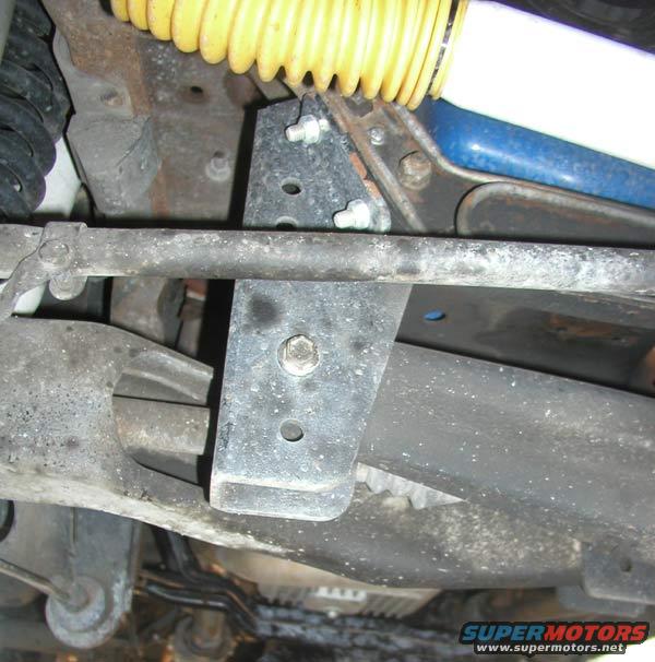 1988 Ford Bronco undercarriage with yellow shock absorber and suspension components