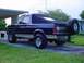 1988 Ford Bronco - This Ford Bronco is parked in a residential driveway under a carport.