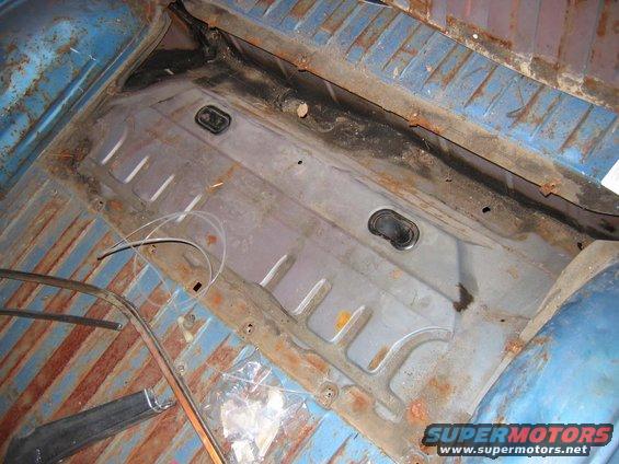 I pulled off the shock access panel in the bed to find,...no rust whatsoever. All you guys that have spent days and days fixing the rust that always grows here can bitch me out. I deserve it. HA! Look, it even has the original plastic hole plugs. Freakin' crazy.