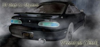 1993 Mazda MX-6 rear view, black, with spoiler and custom plate