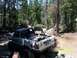 1976 Ford F-100 - A modified Toyota pickup truck navigates a rocky, wooded trail.