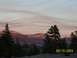 1976 Ford F-100 - A scenic view of mountains and trees during a colorful sunset, with a date watermark.