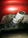 2000 Ford Taurus - Close-up view of a car's exhaust system, showing the muffler and tailpipe.