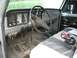 1979 Ford F-150 - Interior view of a 1979 Ford F-150, the dashboard, steering wheel, and floor mats.