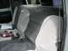 1979 Ford F-150 - The interior of a Ford truck shows the back seat with a "Ford" logo embroidered on the headrest.