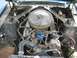 1967 Ford Mustang - Engine bay view of a 1967 Ford Mustang, a chrome air cleaner and visible engine components.