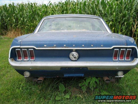 Blue 1967 Ford Mustang rear view with triple taillights