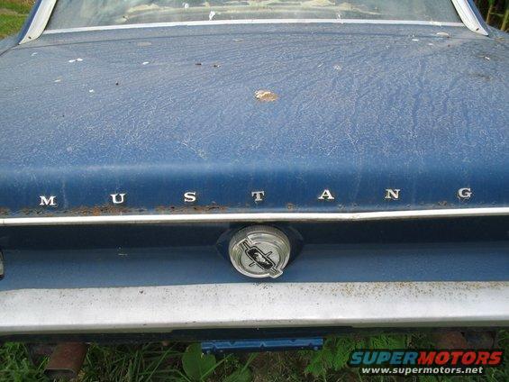 1967 Ford Mustang trunk lid with chrome trim and gas cap