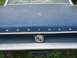 1967 Ford Mustang - Rear view of a blue 1967 Ford Mustang showing the trunk lid and gas cap emblem.