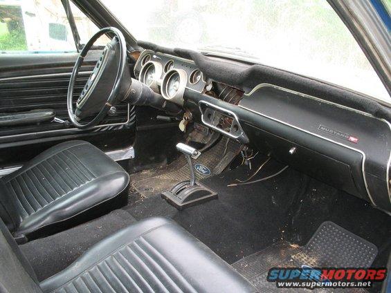1967 Ford Mustang interior with black seats and dashboard