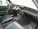 1967 Ford Mustang - The interior of a 1967 Ford Mustang shows its classic dashboard, steering wheel, and seats.