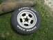1967 Ford Mustang - A tire and wheel assembly with "Radial G/T" and "Super Star" lettering is shown on grass.