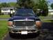 2000 Ford Excursion - This Ford Excursion is parked in front of a suburban house on a sunny day.