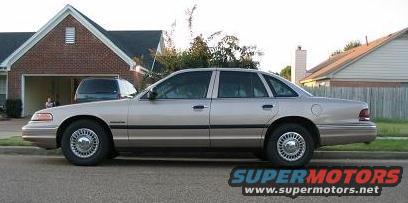 Silver 1995 Ford Crown Victoria sedan, side view
