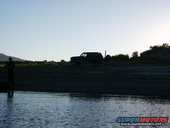 Dark SUV with spare tire on rear, 1996 Ford Bronco