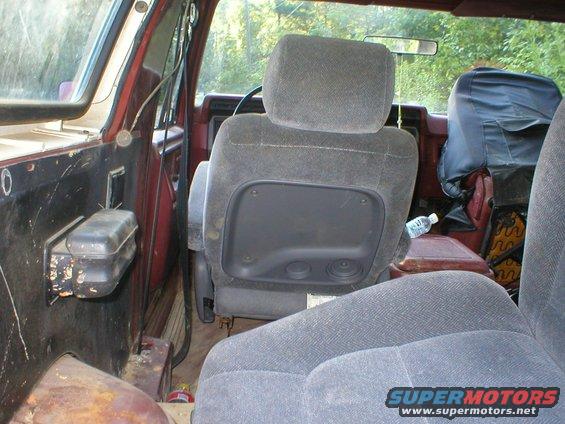 1986 Ford Bronco interior showing front seats and door panel