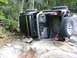 1990 Ford Bronco - This Jeep Wrangler has rolled onto its side while navigating a difficult, rocky terrain.