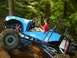 1990 Ford Bronco - A driver navigates a custom off-road buggy through a wooded trail.