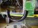 1990 Ford Bronco - A custom exhaust pipe is being fitted inside a vehicle undergoing modifications.