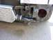 1990 Ford Bronco - Close-up view of aftermarket intercooler and piping installed on a vehicle's front end.