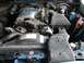 1988 Ford Crown Victoria - Engine bay of a 1988 Ford Crown Victoria, showing the V8 engine and associated components.