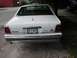 1988 Ford Crown Victoria - Rear view of a white 1988 Ford Crown Victoria sedan parked on a street.