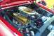 1967 Ford LTD - The engine bay of a red 1967 Ford LTD shows a V8 engine with gold accents and a prominent air filter.