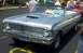 1967 Ford LTD - A light blue 1964 Ford Falcon convertible is parked at an outdoor event with other vehicles.