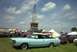 1967 Ford LTD - A light blue 1967 Ford LTD convertible is parked on a grassy field with other vehicles and tents around.