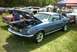1967 Ford LTD - A blue 1967 Ford Mustang is displayed with its hood open at an outdoor car show.