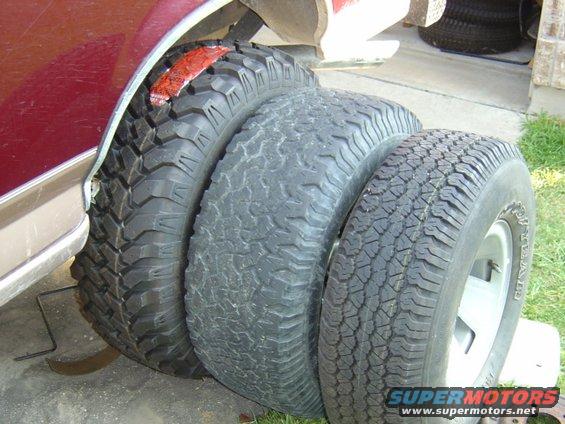 My new tire(s) on left, my tire(s) now in middle, and the stock Bronco tire... I SEE NOW why he went bigger!!   BTW, left to right is 35" ProComp M/T's, 33" BFG A/T's, and the 31" (?) stock tire... Big difference.