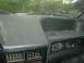 1989 Ford Escort - The interior of a 1989 Ford Escort is visible, with a sticker on the windshield.