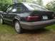 1989 Ford Escort - This 1989 Ford Escort hatchback is seen from the rear quarter angle, parked on a grassy area.