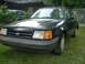 1989 Ford Escort - This 1989 Ford Escort coupe is parked on a grassy lawn in front of a house.