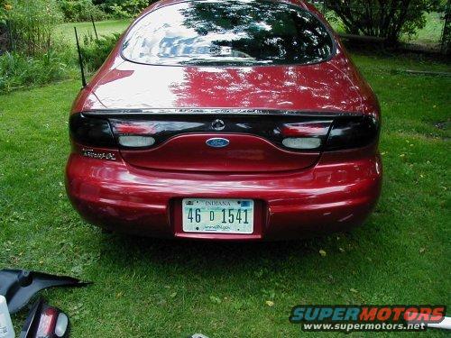 Red 1997 Ford Taurus rear view with Indiana license plate 46 D 1541