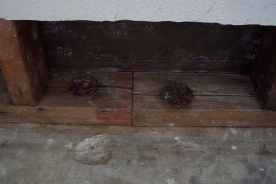 100_0275.jpg Metal washers? nailed to bottom of wall frame
