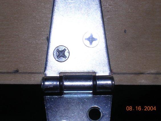 hinge.jpg i learned the hard way that the hing needs to be right on the edge to allow the shelf to fold up.  It still has some clearance probs, but this is going to cover my amps and an inverter, so I dont need to get to it very often.