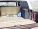 1979 Ford Bronco - The cargo area of a 1978 Ford Bronco, equipped with a rear seat and storage box.