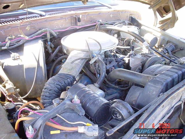 1979 Ford Bronco engine bay with V8 engine, air cleaner, radiator, and battery