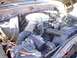 1979 Ford Bronco - The engine bay of a 1979 Ford Bronco shows its V8 engine, air cleaner, and radiator.