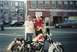 1979 Ford Bronco - Two men pose with a custom motorcycle in front of a building. A van is visible in the background.