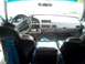 1994 Ford Bronco - The interior of a teal vehicle, black racing seats and a grey dashboard, is viewed from the back seat.