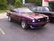 1978 Ford Mustang II - This 1978 Ford Mustang II features a custom purple paint job and a prominent hood scoop, seen here in a three-quarter front view.