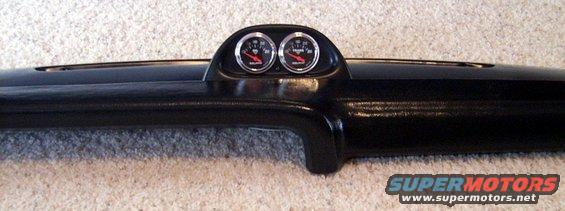 Black dashboard section with two gauges mounted in a pod