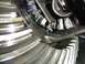 1996 Ford Bronco - Damaged differential gears shown with a tool, likely from a vehicle repair.