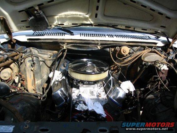 Engine bay with a chrome air cleaner and polished valve covers